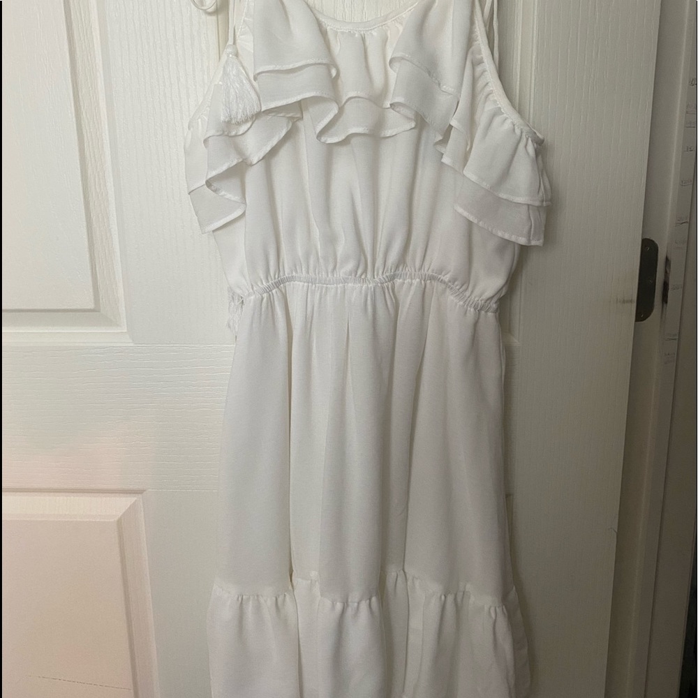 White ruffle dress with tie and tassel straps